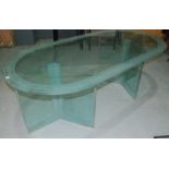 Peter Lord RIBA - T&W Ide Docklands - A large late 20th Century glass table with oval top raised to