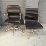 After Charles Eames - A pair of contemporary office chairs based on the Aluminium group EA108 with