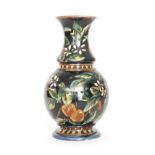 Doulton Lambeth - A late 19th Century vase of footed ovoid form with a flared collar neck,