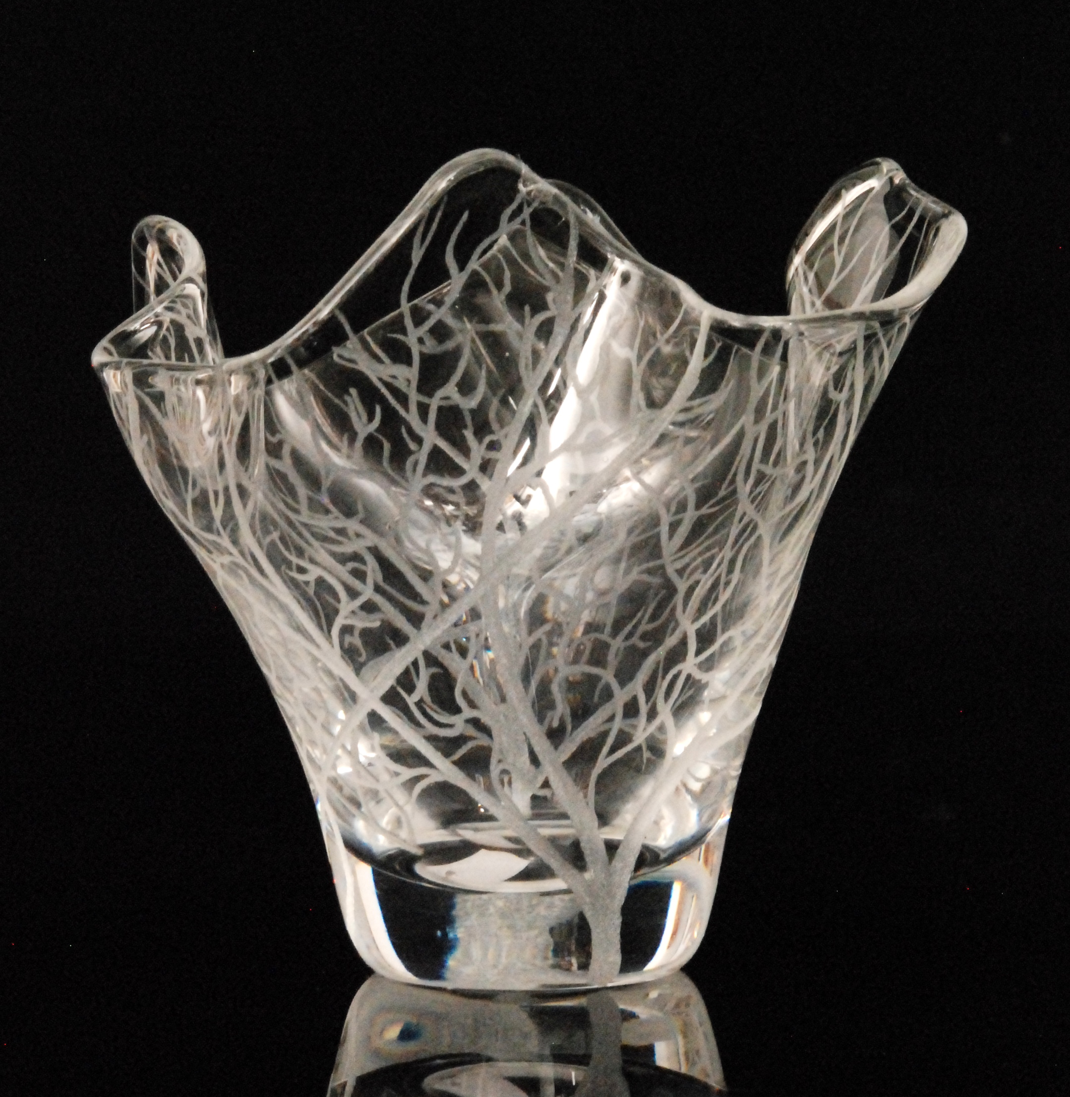 Kosta - A contemporary clear glass vase of handkerchief form engraved with autumnal trees, etched