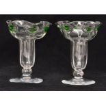 Stuart & Sons - A pair of early 20th Century posy vases each of flared form raised to a spread