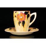 Clarice Cliff - Lydiat - A Lynton shape coffee can and saucer circa 1933, hand painted with a band