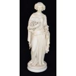 A late 19th Century Parian figure modelled as a Bacchanalian lady holding fruit and berries in one