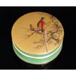 A Royal Worcester powder box and cover of circular form decorated in the manner of Shuck with