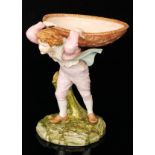 An early 20th Century Royal Worcester figural comport modelled as a young boy with patterned