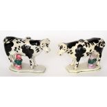 A pair of late 19th to early 20th Century Staffordshire models of black and white cows each with a