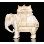 A Royal Worcester model of a caparisoned elephant with a howdah,