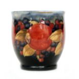A William Moorcroft Pomegranate cache pot or small planter decorated with a band of whole fruit and