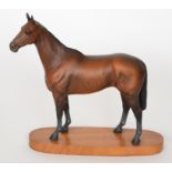 A Beswick model of Arkle, model 2065 from the Connoisseur Horses series, raised to an oval plinth,