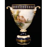 An early 20th Century Royal Worcester pedestal vase decorated by Harry Davis with a country