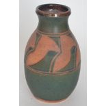 A contemporary studio pottery vase decorated with an upper band of terracotta chevron design