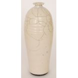 A contemporary studio pottery vase of tapering form decorated in a Raku glaze, indistinctly signed,