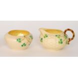 A Belleek third period milk jug and sugar bowl,