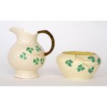 A Belleek third period jug of footed spherical form,