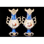 A pair of late 19th to early 20th Century Continental vases each decorated with hand painted
