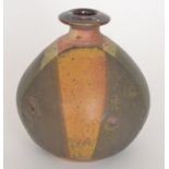 A small contemporary studio pottery ovoid vase with a squat flared neck,