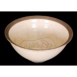 A contemporary studio pottery high sided bowl decorated in a Raku glaze with burnished unglazed
