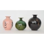 Three contemporary studio pottery vases each of ovoid form with flared collar necks,