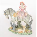 A Francis Berrisford studio pottery mythical tableau model of a lady sat upon a unicorn with a goat,