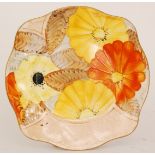 A 1930s Art Deco Grays Pottery side plate decorated with large hand painted flowers against a