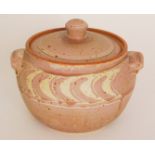 A contemporary studio pottery lidded tureen of circular form decorated with a salmon pink chevron