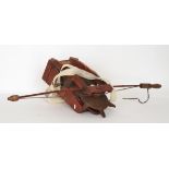 A 19th Century seed spreader 'The Areo', red stained sides with canvas bag and shoulder strap,