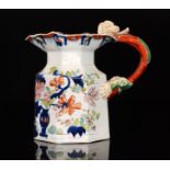 A 19th Century Masons Ironstone water jug decorated in iron red and underglaze blue with vases of