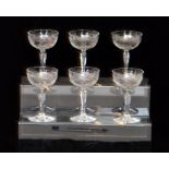 A set of six early 20th Century clear crystal champagne coupes with a shallow circular bowl