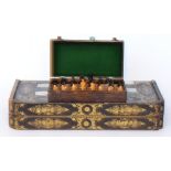An early 20th Century Staunton style chess set each with magnetic bases in later fitted hinged case