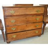 A George III mahogany secretaire chest fitted with drawers and pigeon holes centred by a cupboard
