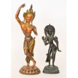 A 20th Century copper and brass Indonesian statue of a dancing goddess wearing a headdress,