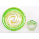 A contemporary studio glass plaque of shallow circular form decorated with a two tone green spiral