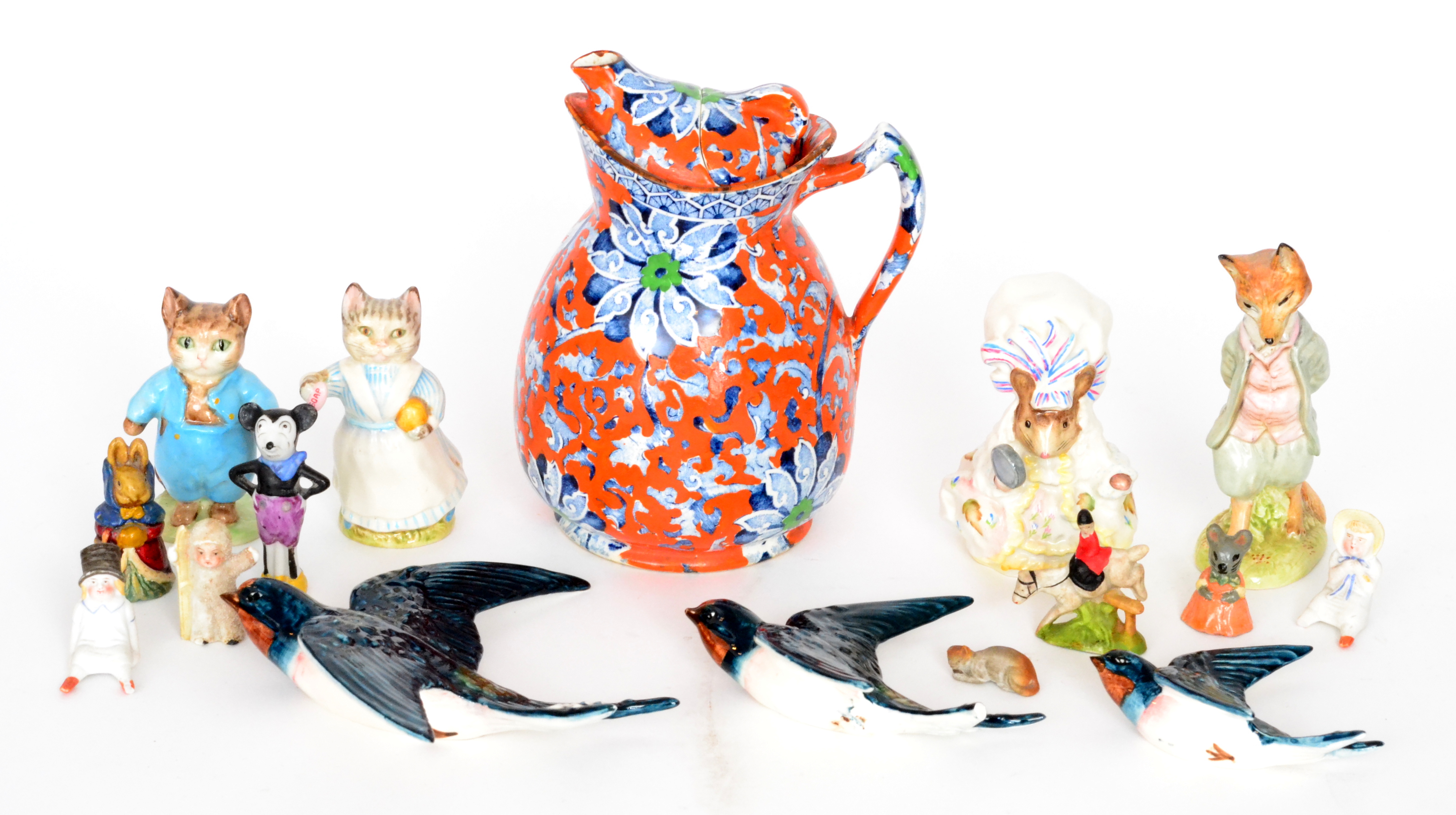 A small mixed lot to include a set of three graduated Beswick kingfishers,