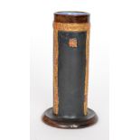 An early 20th Century Royal Doulton spill vase of cylindrical form decorated with relief moulded