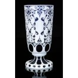 A late 19th Century cameo glass vase, possibly Stourbridge, of footed cylindrical form,