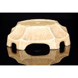 A Ruskin Pottery crystalline glazed stand of segmented form decorated in a tonal sand colour,