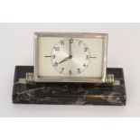 A 1930s French Art Deco mantle clock the hinged chromium case enclosing a silvered dial and Arabic