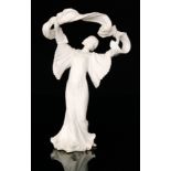 A late 19th Century Parian model of an Art Nouveau lady dressed in a bell sleeve dress and holding