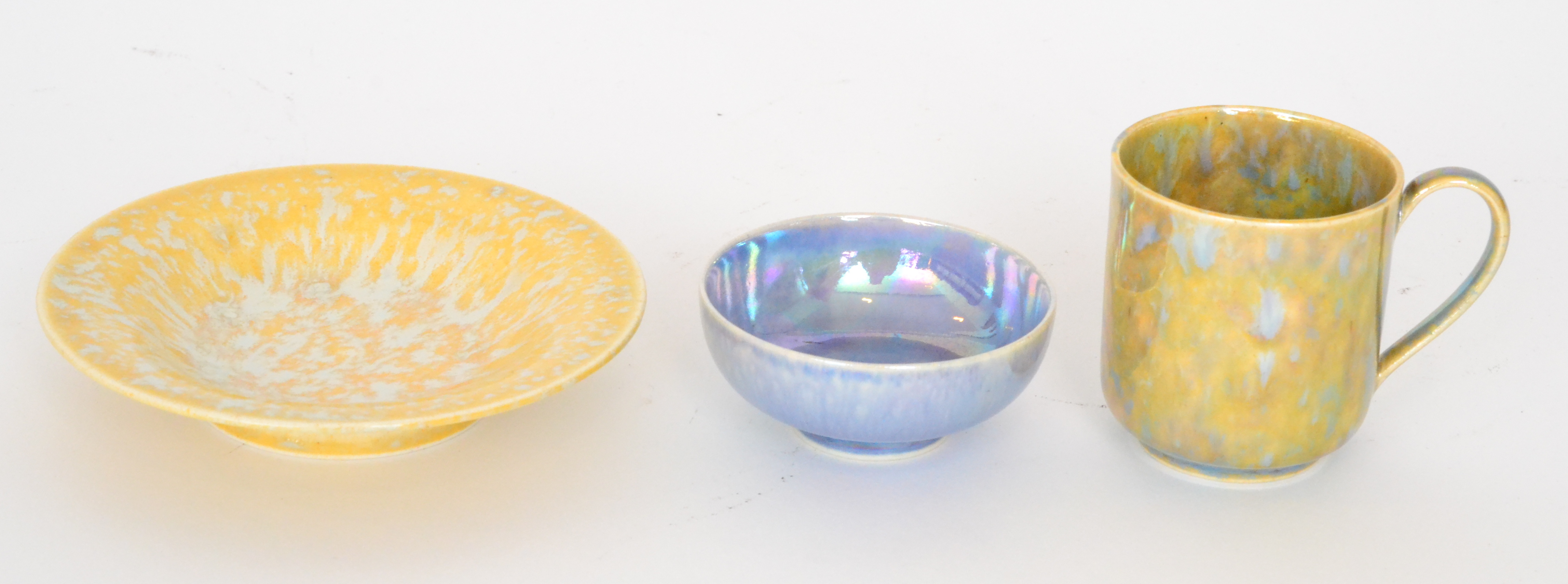 Three pieces of assorted Ruskin Pottery lustre glaze comprising a mottled yellow and blue coffee