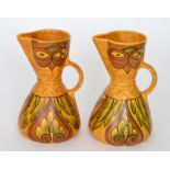 A pair of 1930s Art Deco Flaxman Ware by Wadeheath jugs each decorated with foliage and abstract