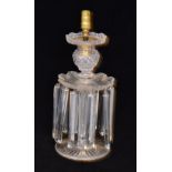 A 19th Century Wilkinsons clear crystal table lustre candlestick with a radial cut circular foot