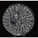 A Whitefriars glass sun catcher of circular form with stylised sun mask face design to the flint