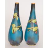 A pair of early 20th Century Burleigh Ware Burgess and Leigh skittle vases decorated with transfer