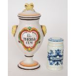 Two reproduction drug jars, the first of footed baluster form with a domed covered lid, painted  El.