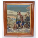A late 19th Century tapestry panel of a Bavarian Hunter sat upon rocks,
