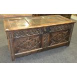 An 18th Century carved oak coffer,