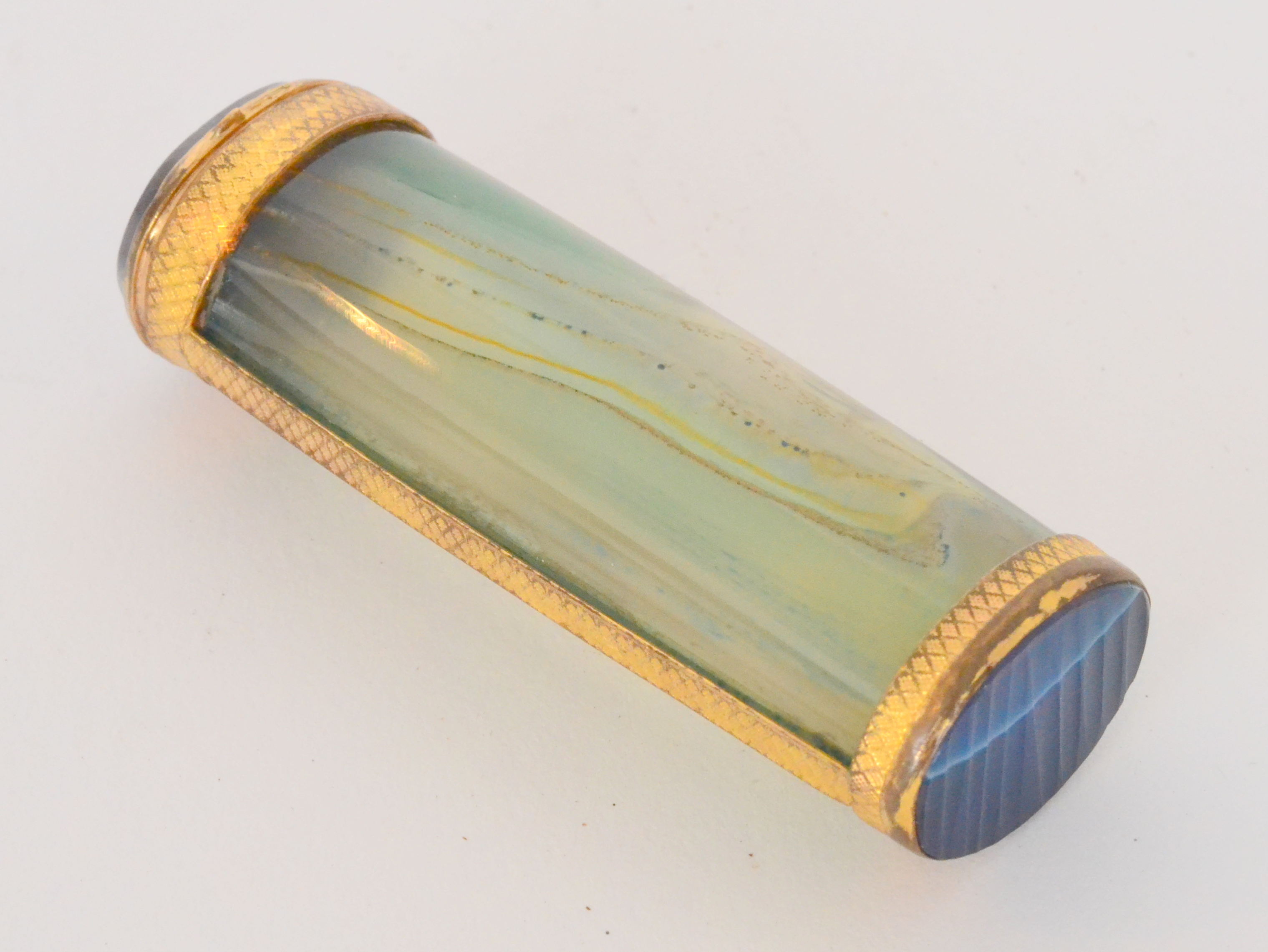 A late 19th Century gilt metal mounted agate case of oval cylindrical form,