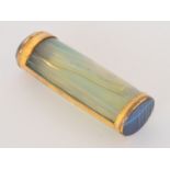 A late 19th Century gilt metal mounted agate case of oval cylindrical form,