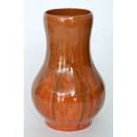 A 1930s Pilkington's Royal Lancastrian vase of globe and shaft form decorated with a tonal orange