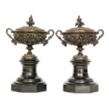 A pair of 19th Century bronze twin handled classical campana twin handled pedestal vases and covers,